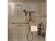 Updated bathroom shower features a hand shower and a grab bar for safety at 3530 Piedmont Ne Rd # 3I, Atlanta, GA 30305