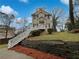 Charming two-story home with inviting front porch and landscaped front yard at 483 Fairlane Nw Cir, Atlanta, GA 30331