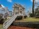 Charming two-story home with a quaint front porch and landscaped front yard at 483 Fairlane Nw Cir, Atlanta, GA 30331