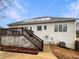 View of the backyard with a wooden deck, stairs, and an air conditioning unit at 4905 Ascot Nw Blf, Acworth, GA 30102