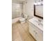 Full bathroom with tiled floors, vanity with white cabinets, and shower-tub combo at 4905 Ascot Nw Blf, Acworth, GA 30102