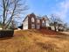 View of the home's front exterior with lawn and manicured shrubbery at 4905 Ascot Nw Blf, Acworth, GA 30102