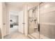 Bathroom featuring glass enclosed shower with gray tile and neutral tile floor at 4929 Dufour Dr, Lilburn, GA 30047