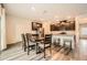 Open concept kitchen and dining area featuring dark cabinets, stainless appliances and hardwood floors at 4929 Dufour Dr, Lilburn, GA 30047