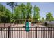 Community playground with a swing set, slide, climbing wall and safety mulch ground cover at 4929 Dufour Dr, Lilburn, GA 30047