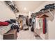 Spacious walk-in closet with built in shelving and hanging racks for ample storage at 4929 Dufour Dr, Lilburn, GA 30047