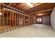 Unfinished basement showcasing the stud framing, concrete foundation, and exposed ceiling joists at 10625 Haynes Forest Dr, Alpharetta, GA 30022