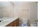 Neutral toned bathroom featuring tile flooring, large mirror, and a standard toilet and shower with tub at 10625 Haynes Forest Dr, Alpharetta, GA 30022
