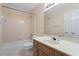 Well-maintained bathroom with a tub, toilet, and vanity, offering a practical design at 10625 Haynes Forest Dr, Alpharetta, GA 30022