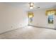 Bright bedroom features two windows with valances, offering ample space and natural light at 10625 Haynes Forest Dr, Alpharetta, GA 30022