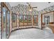 Bright breakfast nook with floral wallpaper, large windows, and access to the outdoors at 10625 Haynes Forest Dr, Alpharetta, GA 30022