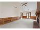 Large living room with a brick fireplace, high ceilings, wood trim, and access to the outdoors at 10625 Haynes Forest Dr, Alpharetta, GA 30022