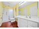 A well-lit bathroom with white cabinets and a walk-in shower at 2160 Carefree Cir # 9, Marietta, GA 30062