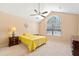 Bedroom with a ceiling fan and a large window to bring in natural light at 2160 Carefree Cir # 9, Marietta, GA 30062