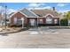 The front of a brick leasing office/clubhouse with ample parking and landscaping at 2160 Carefree Cir # 9, Marietta, GA 30062