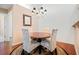 Well-lit dining area showcasing stylish chairs, a wood table, and a decorative mirror at 2160 Carefree Cir # 9, Marietta, GA 30062