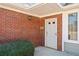 Close-up of the front door area, highlighting the brick facade and an address marker at 2160 Carefree Cir # 9, Marietta, GA 30062