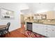 Bright kitchen featuring white cabinets, granite countertops, and stainless steel dishwasher at 2160 Carefree Cir # 9, Marietta, GA 30062