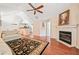Spacious living room featuring a fireplace, elegant décor, and wood flooring, perfect for relaxation and entertainment at 2160 Carefree Cir # 9, Marietta, GA 30062