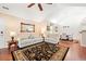 Cozy living room with high ceilings, a ceiling fan, and comfortable seating, providing a warm ambiance at 2160 Carefree Cir # 9, Marietta, GA 30062