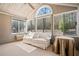 Bright sunroom with vaulted ceilings, large windows, and comfortable seating, ideal for relaxation and enjoying the view at 2160 Carefree Cir # 9, Marietta, GA 30062