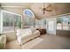 Relaxing sunroom with vaulted ceiling, fan, and ample windows, offering a peaceful retreat with natural light and views at 2160 Carefree Cir # 9, Marietta, GA 30062