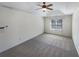 Bedroom features carpet flooring, ceiling fan, and a window with natural light at 2208 Howell Farms Nw Pt, Acworth, GA 30101