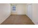 Neutral bedroom features plush carpeting, closet, window with natural light, and cream painted walls at 2208 Howell Farms Nw Pt, Acworth, GA 30101