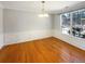 Formal dining room featuring hardwood floors, wainscoting, and a chandelier at 2208 Howell Farms Nw Pt, Acworth, GA 30101