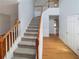 Inviting foyer with hardwood floors, stairway, and a view into adjacent rooms at 2208 Howell Farms Nw Pt, Acworth, GA 30101