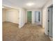 Hallway with multiple rooms branching off, with neutral carpeting and fresh paint at 2208 Howell Farms Nw Pt, Acworth, GA 30101