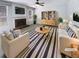 Bright living room featuring a fireplace, ceiling fan, and modern decor for a comfortable space at 2208 Howell Farms Nw Pt, Acworth, GA 30101