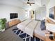 This light and airy primary bedroom includes an ensuite bathroom and a calming color palette at 2208 Howell Farms Nw Pt, Acworth, GA 30101