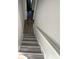 Staircase featuring wood-look steps at 2208 Howell Farms Nw Pt, Acworth, GA 30101