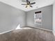 Bright bedroom featuring a ceiling fan and a window providing natural light at 338 Thorn Thicket Dr, Rockmart, GA 30153