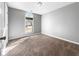 Comfortable bedroom with neutral walls and large arched window at 338 Thorn Thicket Dr, Rockmart, GA 30153