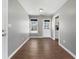 Dining room featuring hardwood floors, gray walls, and natural light with view of kitchen at 338 Thorn Thicket Dr, Rockmart, GA 30153
