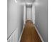 Hallway features clean neutral walls and wood-look floors at 338 Thorn Thicket Dr, Rockmart, GA 30153