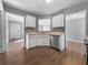 Kitchen area showcasing white cabinets, neutral countertops, and stainless steel dishwasher at 338 Thorn Thicket Dr, Rockmart, GA 30153