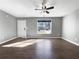 Bright, open living room featuring hardwood floors and a white door at 338 Thorn Thicket Dr, Rockmart, GA 30153