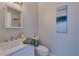 Clean and modern bathroom with white fixtures and a mirror above the sink at 20 Marietta Nw St # 15D, Atlanta, GA 30303