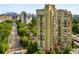 Scenic aerial perspective of an apartment building with surrounding cityscape and tree-lined streets at 2626 Peachtree Nw Rd # 206, Atlanta, GA 30305