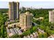 Beautiful aerial shot displaying the building's architecture amid a vibrant cityscape and tree-lined streets at 2626 Peachtree Nw Rd # 206, Atlanta, GA 30305
