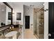 Well-lit bathroom featuring a glass shower enclosure and granite countertops at 2626 Peachtree Nw Rd # 206, Atlanta, GA 30305