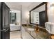 Tasteful bathroom featuring a granite countertop, decorative mirror, and neutral color palette at 2626 Peachtree Nw Rd # 206, Atlanta, GA 30305