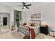 Stylish bedroom showcasing an iron bed frame and soft, patterned rug at 2626 Peachtree Nw Rd # 206, Atlanta, GA 30305