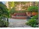 Serene courtyard with lush greenery, a charming water fountain, and inviting seating for outdoor enjoyment at 2626 Peachtree Nw Rd # 206, Atlanta, GA 30305