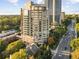 High-rise apartment building showcasing expansive balconies and city views, surrounded by lush greenery at 2626 Peachtree Nw Rd # 206, Atlanta, GA 30305