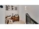 Cozy hallway with decorative chairs, artwork, and natural light with black railing at 2626 Peachtree Nw Rd # 206, Atlanta, GA 30305
