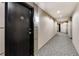 Hallway displaying carpet flooring, neutral walls, and access to unit 206 at 2626 Peachtree Nw Rd # 206, Atlanta, GA 30305